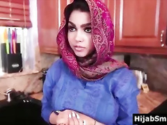 Muslim girl in hijab obeys her American host